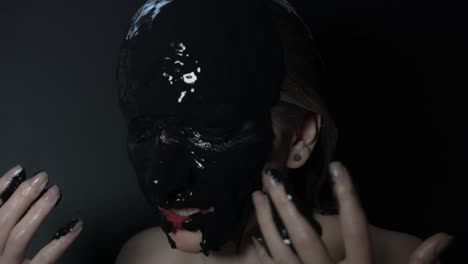 4k-shoot-of-a-horror-Halloween-model---Woman-in-black-mud-screaming-at-camera