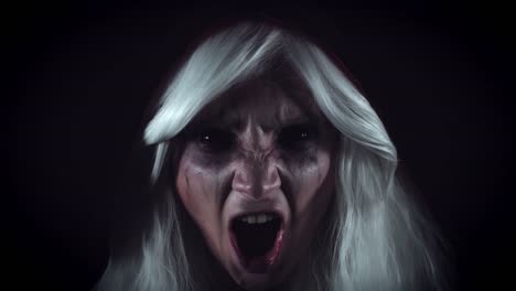 4K-Horror-Witch-Appearing-from-Darkness-Screaming