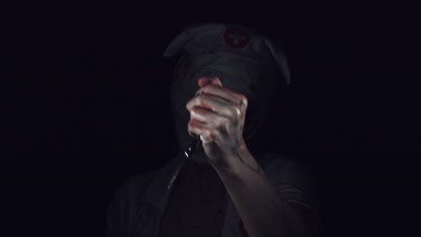 4k-Horror-Nurse-Zombie-Gesturing-with-Scissors