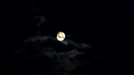 Clouds-passing-by-moon-at-night.-Full-moon-at-night-with-cloud-real-time.-Details-on-surface-visible