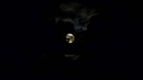 Clouds-passing-by-moon-at-night.-Full-moon-at-night-with-cloud-real-time.-Details-on-surface-visible