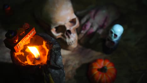 Halloween-day-footage-with-skull,-pumpkin,-candle-light,-and-movement