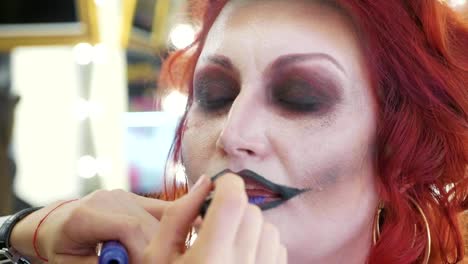 Process-applying-halloween-makeup-on-face-the-woman-in-nurse-style