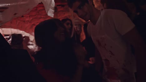 Young-friends-dancing-and-flirting-at-Halloween-party