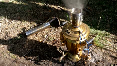 Big-old-Bronze-samovar-stands-on-the-ground-and-prepares-tea