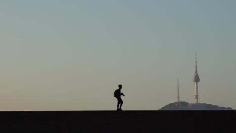 Young-Male-Traveler-taking-photos-in-Seoul-City,-South-Korea.