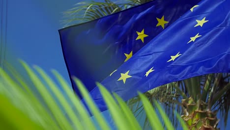 Waving-European-Union-flag-in-the-wind-with-a-blue-sky.