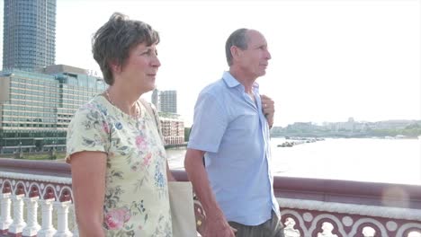 Active-senior-couple-walking-in-london