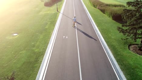 The-man-rollerblading-on-the-alley.-quadrocopter-shot