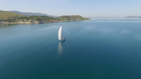 a-single-sailboat-in-the-middle-of-the-sea-in-izmir