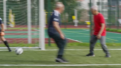 Active-Pensioners-Playing-Football-Together