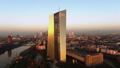 Frankfurt-ECB-Skyline-Aerial-Shot-at-early-sunrise-reflecting-sun