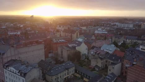 Aerial-view-of-Lund-city,-Sweden.-Drone-shot-flying-over-Lund-cityscape-at-sunset