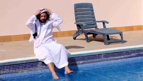 Saudi-arabian-man-enjoying-at-swimming-pool