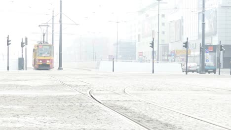 Tram-waiting-for-green-light-at-road-intersection