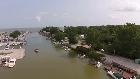 Red-boat-entering-marina-aerial-view