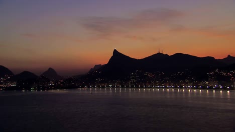 Low-angle-aerial-view-of-Rio-de-Janeiro-Bay-at-Dusk,-Brazil