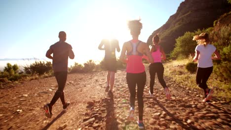 Group-of-mutli-ethnical-athletes-running-outdoors