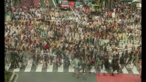 Tokio,-Japón.-Día-Lapso-de-tiempo-de-personas-caminando-el-cruce-de-Shibuya-durante-la-noche