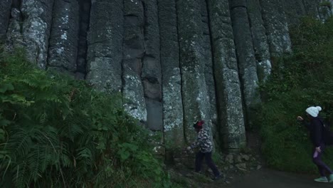 4k-Shot-of-Tourists-on-Giant's-Causeway,-Northern-Ireland