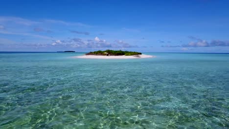 v03859-Aerial-flying-drone-view-of-Maldives-white-sandy-beach-2-people-young-couple-man-woman-relaxing-on-paddleboard-on-sunny-tropical-paradise-island-with-aqua-blue-sky-sea-water-ocean-4k