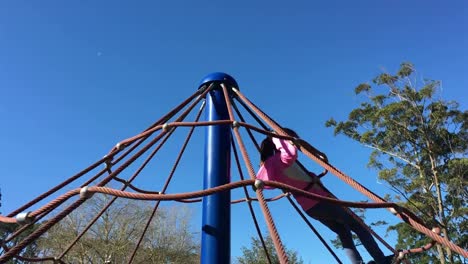 Young-girl-rotating-on-on-a-merry-go-round