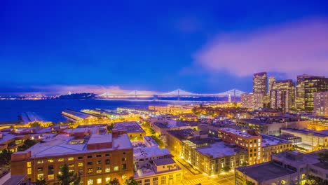 Tiempo-transcurrido---vista-aérea-de-San-Francisco-la-noche-con-puente-de-la-bahía---4K