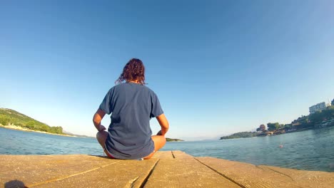 4K-beach-yoga,-caucasian-girl-on-a-dock,-wide-shoot,-quad-HD