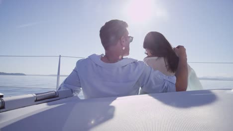 Young-couple-on-sailboat-together.