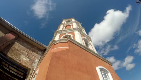 Colonial-16th-century-Spanish-built-of-Saint-Paul-the-First-Hermit-Cathedral-also-known-as-San-Pablo-Cathedral,-showing-her-bell-tower.-tracking-shot