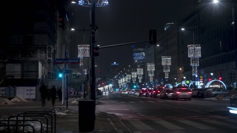 Night-time-lapse-of-busy-crossroads-with-Christmas-decorations