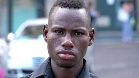 Confident-young-black-man-looks-at-camera--outdoor--slow-motion