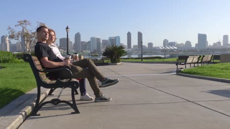 Couple-relaxing-on-San-Diego-City-bench