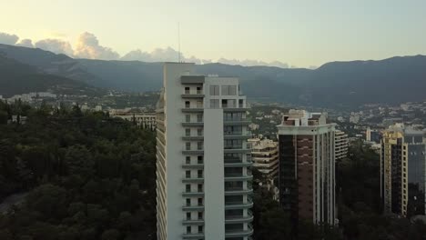 new-modern-apartment-building-skyscrapers-in-the-mountain-city-aerial-panorama-view