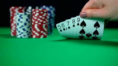 Straight-flush-in-poker,-player-holding-great-combination,-victory,-success