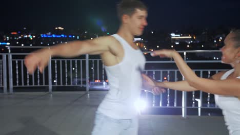 Couple-of-lovers-dancing-in-empty-night-street,-dating-and-love,-seduction