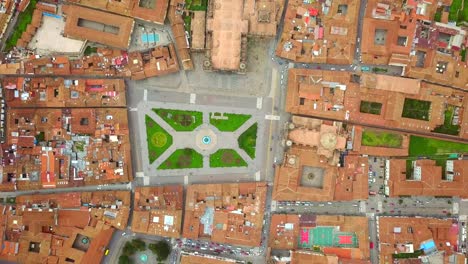 Aerial-view-of-Cuzco-city-red-rooftops,-Peru.