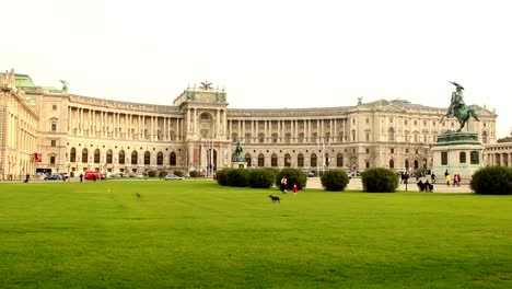 Green-lawn-Heldenplatz-OSCE-headquarters-in-Vienna-Austria,-dogs.-Beautiful-shot-of-Europe,-culture-and-landscapes.-Traveling-sightseeing,-tourist-views-landmarks-of-Austria.-World-travel,-west-European-trip-cityscape,-outdoor-shot