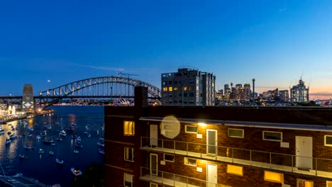 Atardecer-en-el-Puente-del-Puerto-de-Sídney,-Australia.-Lapso-de-tiempo.