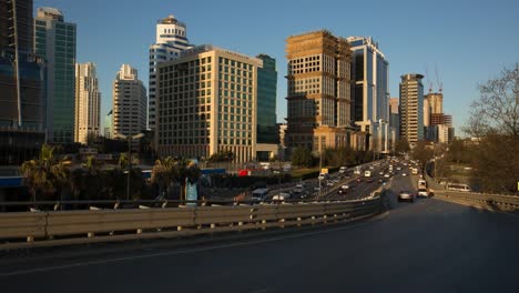 Sunset-road-traffic,-skyscrapers-and-Maslak-,-Istanbul