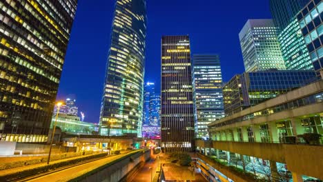 france-paris-night-la-defense-office-buildings-block-traffic-street-panorama-4k-time-lapse