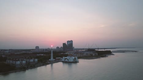 Aerial-Footage---Sunrise-at-a-mosque,-The-Melaka-Straits-Mosque.