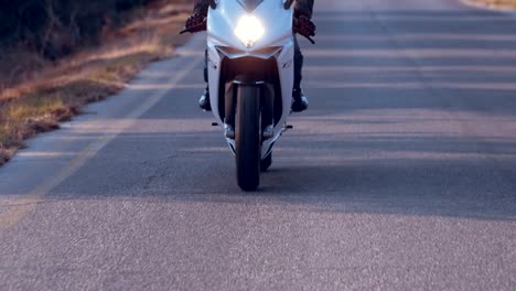 Man-riding-on-a-white-sports-motorcycle