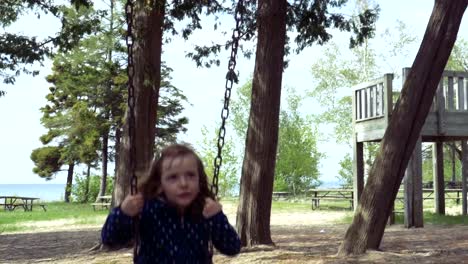 Little-Girl-Laughing-on-a-Swing