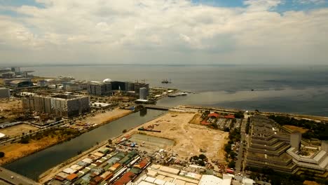 Luftbild-Stadt-mit-Wolkenkratzern-und-Gebäuden.-Philippinen,-Manila,-Makati