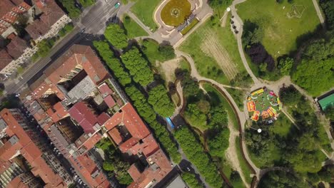 italy-sunny-day-milan-city-blocks-park-side-aerial-down-view-4k