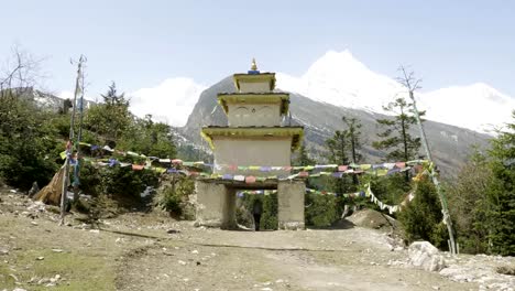 Tourist-leaves-the-village-through-the-arch-on-trekking-in-Himalaya,-Nepal.