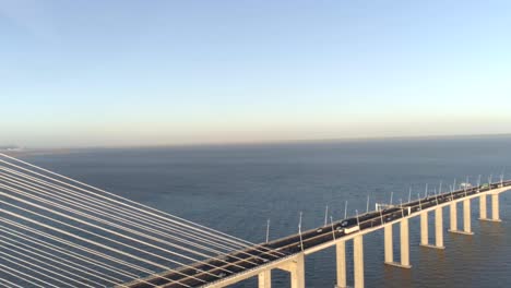 Aerial-Drone-video-of-Ponte-Vasco-da-Gama-Bridge-with-cars-passing-by