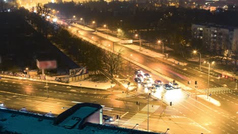 Night-time-lapse-of-busy-crossroad-(close-up)