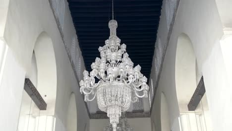 tilt-down-shot-of-chandeliers-at-al-hakim-mosque-in-cairo,-egypt